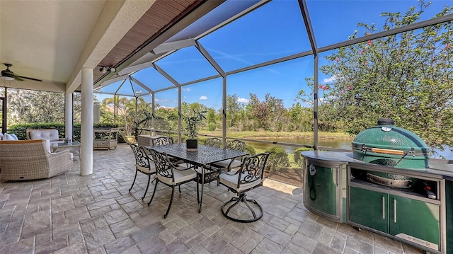 6621 The Masters Ave, Lakewood Ranch, FL 34202 - view of patio with outdoor dining area, a lanai, view of scattered trees, and ceiling fan