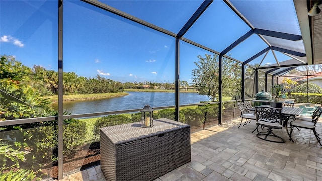 6621 The Masters Ave, Lakewood Ranch, FL 34202 - view of patio featuring a water view, a lanai, and outdoor dining area
