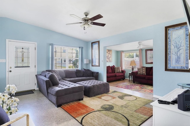 living area with lofted ceiling and ceiling fan