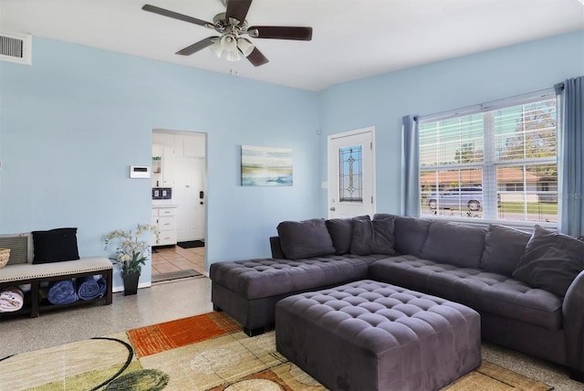 2564 Wood St, Sarasota, FL 34237 - living area featuring visible vents, ceiling fan, and speckled floor