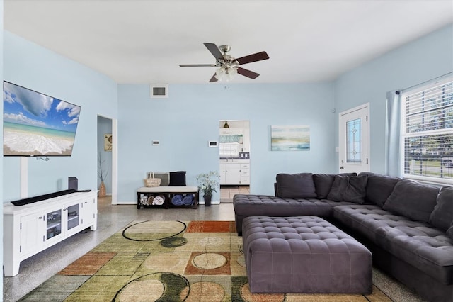 2564 Wood St, Sarasota, FL 34237 - living room featuring ceiling fan, visible vents, and baseboards