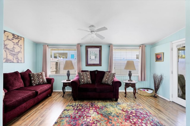2564 Wood St, Sarasota, FL 34237 - living area featuring baseboards, wood finished floors, and a healthy amount of sunlight