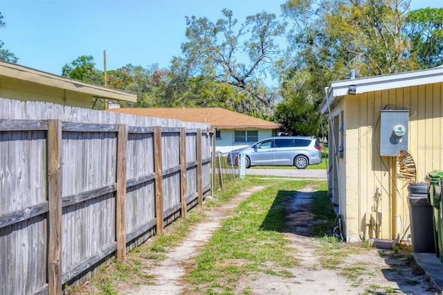 2564 Wood St, Sarasota, FL 34237 - view of yard featuring driveway and fence