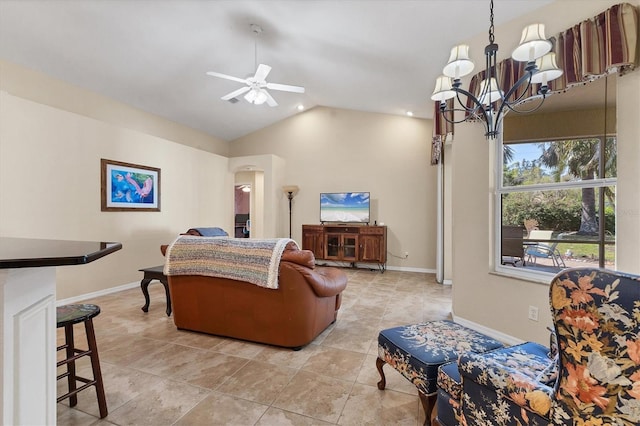 living area with light tile patterned floors, baseboards, arched walkways, lofted ceiling, and ceiling fan with notable chandelier