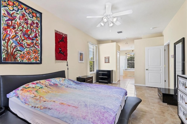 bedroom featuring light tile patterned floors, connected bathroom, a ceiling fan, visible vents, and baseboards