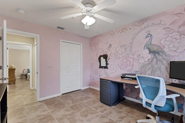 office featuring a ceiling fan, visible vents, baseboards, and wallpapered walls