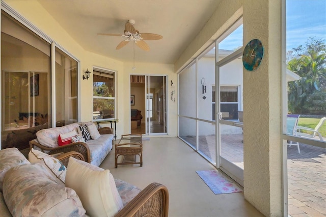 sunroom / solarium with ceiling fan