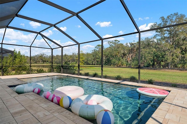 outdoor pool with a lanai, a patio area, and a yard