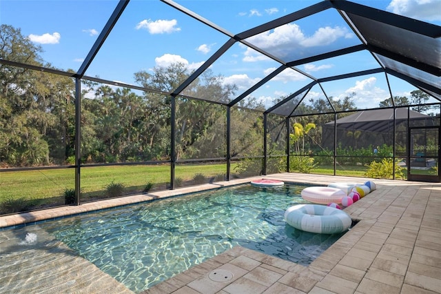 pool featuring a patio, a lawn, and a lanai