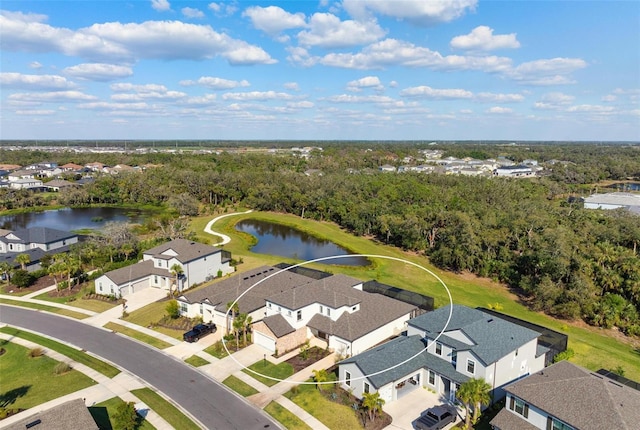 aerial view with a water view, a residential view, and a view of trees