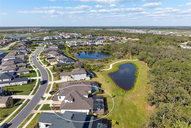 drone / aerial view with a residential view and a water view