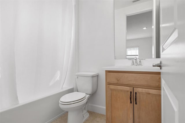 bathroom featuring shower / bath combo, vanity, toilet, and baseboards