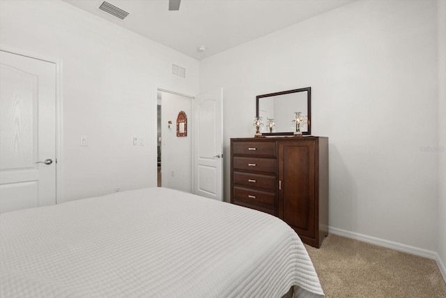 bedroom with light colored carpet, visible vents, ceiling fan, and baseboards