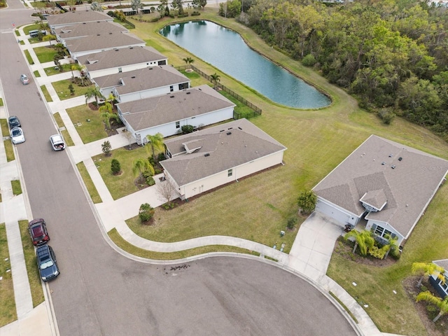 birds eye view of property featuring a water view and a residential view