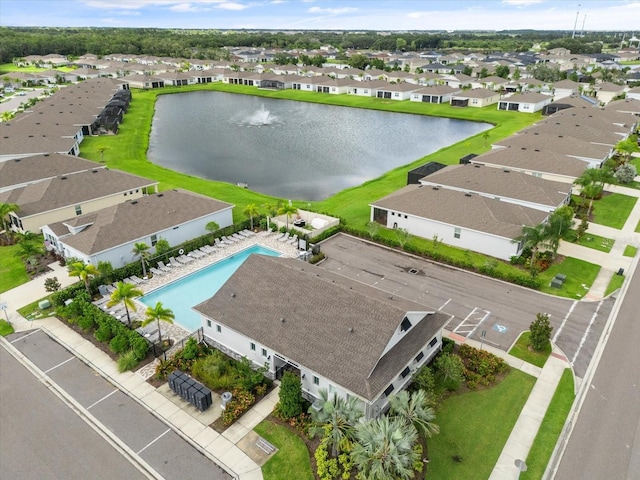 aerial view with a residential view and a water view