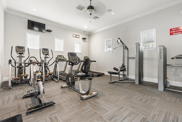 exercise room featuring ornamental molding, carpet, visible vents, and baseboards