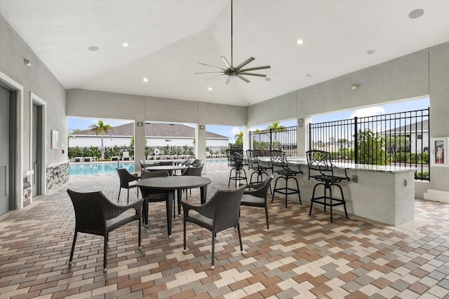 dining room with high vaulted ceiling, a ceiling fan, and recessed lighting