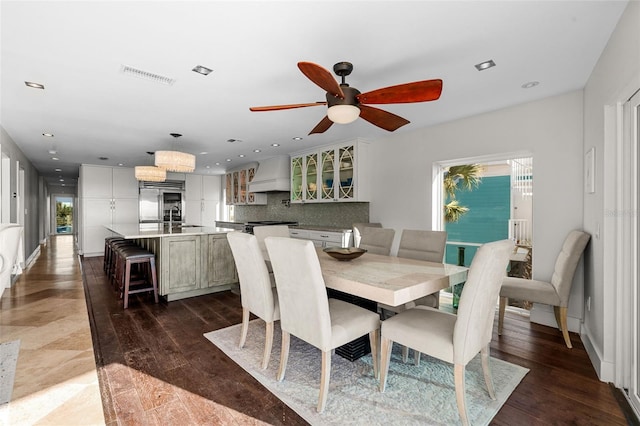 dining room with dark wood-type flooring, recessed lighting, and visible vents