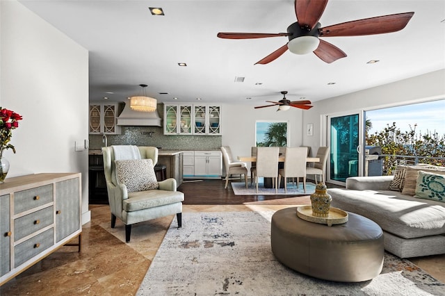 living room featuring recessed lighting and visible vents