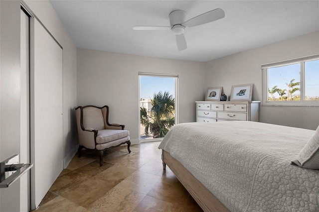 bedroom with a ceiling fan and access to exterior