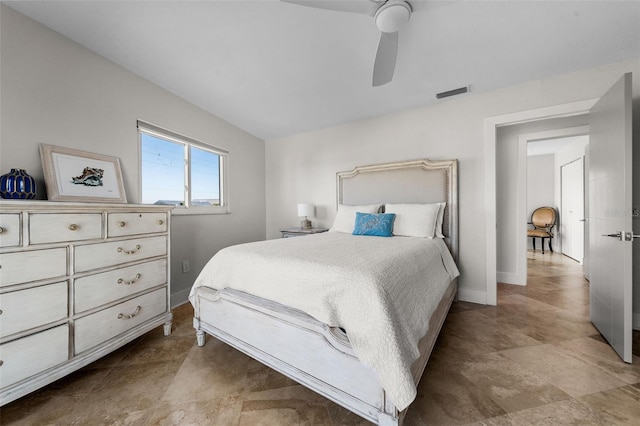 bedroom with a ceiling fan, visible vents, and baseboards