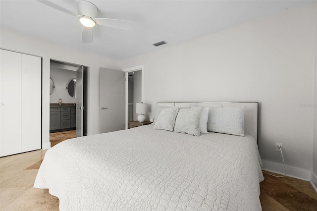 bedroom with baseboards, ensuite bath, visible vents, and a ceiling fan