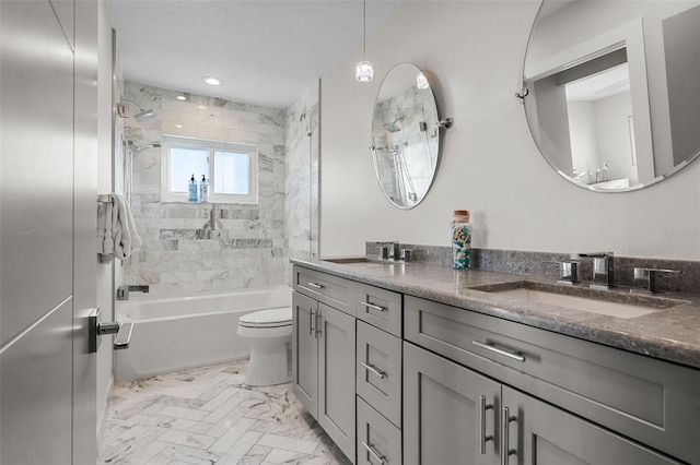 full bath with double vanity, toilet, tub / shower combination, a textured ceiling, and a sink