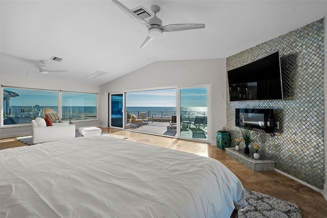 bedroom featuring lofted ceiling, ceiling fan, an accent wall, visible vents, and access to exterior