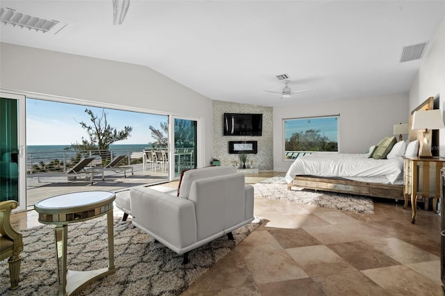 bedroom with lofted ceiling, access to outside, a fireplace, and visible vents