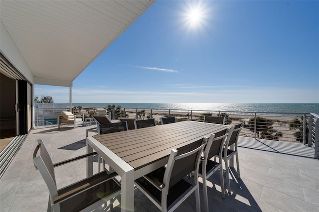 view of patio featuring outdoor dining space and a water view