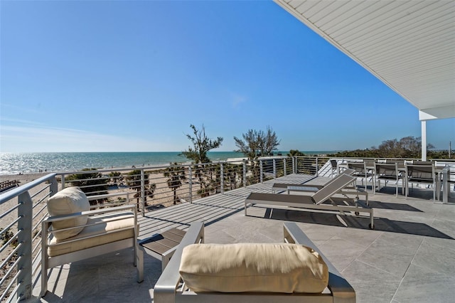 view of patio with a water view