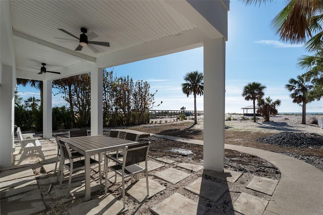 view of patio featuring outdoor dining area and ceiling fan