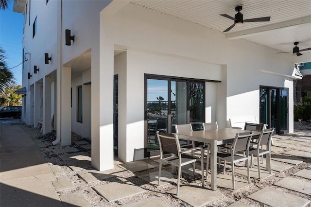 view of patio / terrace featuring outdoor dining area and ceiling fan