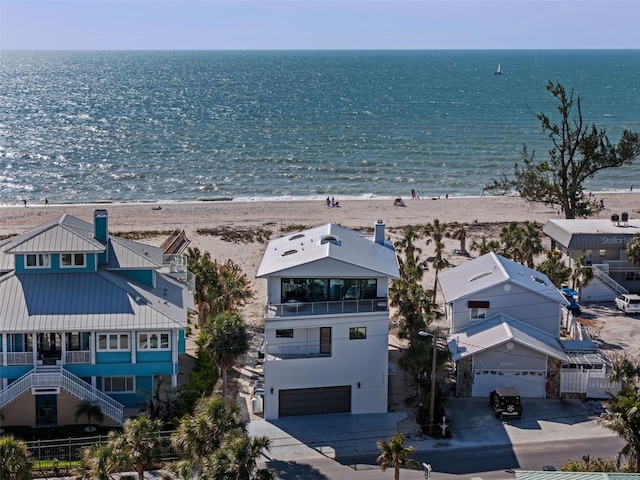 aerial view with a water view and a view of the beach