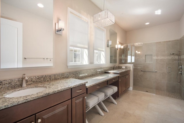 bathroom featuring recessed lighting, vanity, and a shower stall