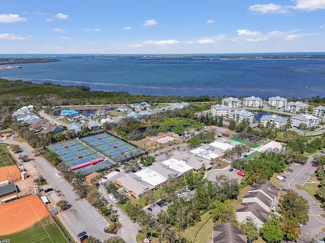 birds eye view of property with a water view