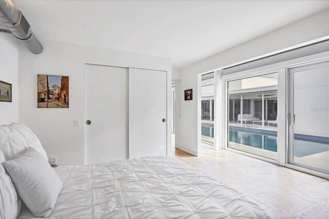 unfurnished bedroom featuring a closet and access to exterior