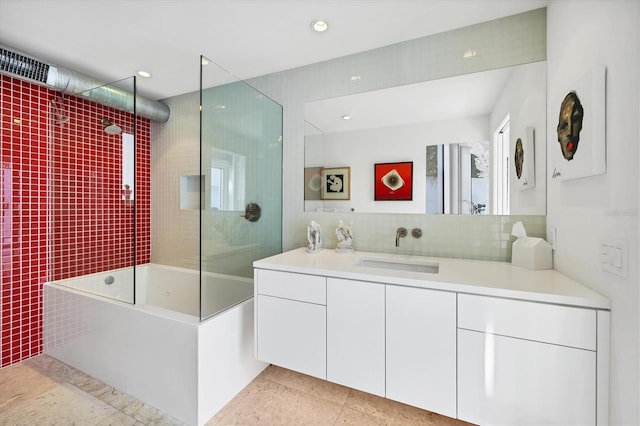 bathroom featuring decorative backsplash, recessed lighting, vanity, and shower / washtub combination