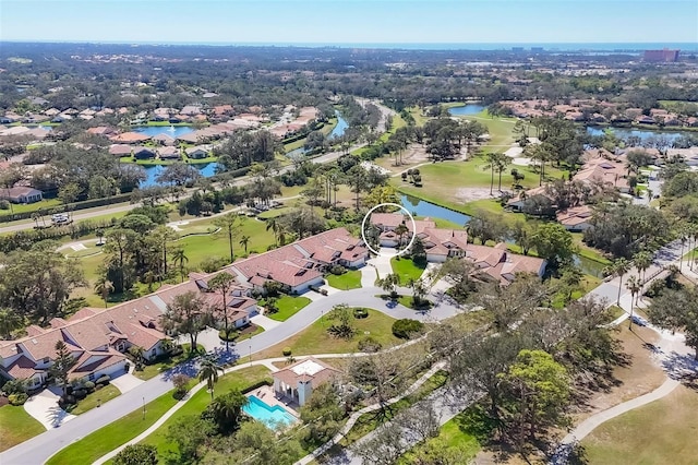 bird's eye view featuring view of golf course, a water view, and a residential view