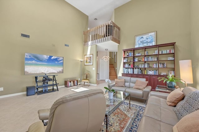 tiled living room featuring a high ceiling, baseboards, stairs, and visible vents