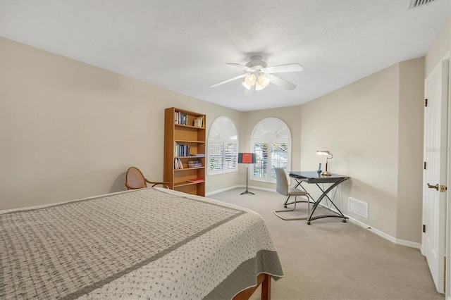 bedroom featuring a ceiling fan, carpet, visible vents, and baseboards