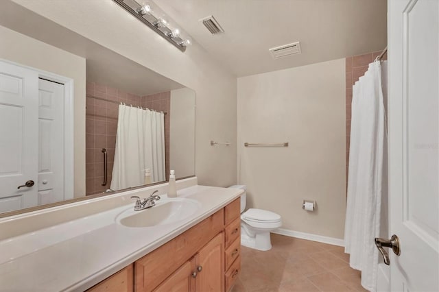 bathroom with tile patterned flooring, visible vents, vanity, and baseboards