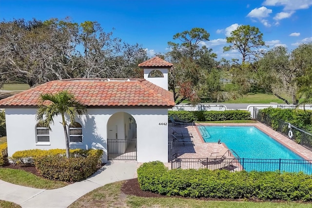 view of swimming pool with fence and a fenced in pool