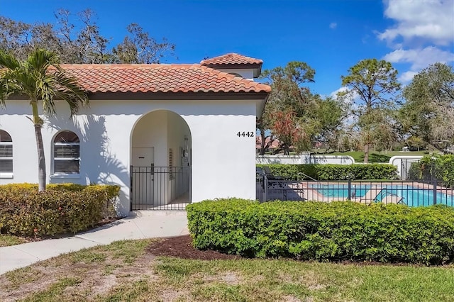 exterior space featuring fence and a fenced in pool