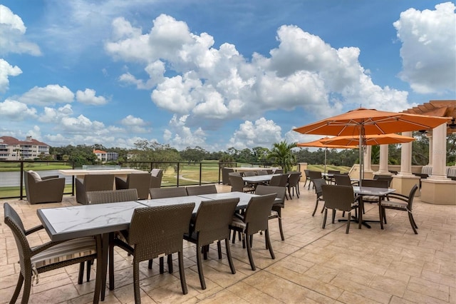 view of patio featuring outdoor dining area