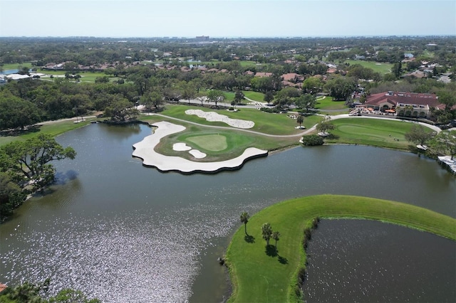 bird's eye view featuring a water view and view of golf course