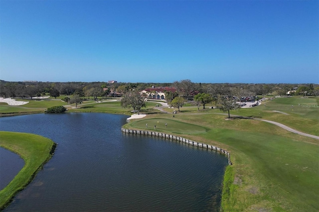 drone / aerial view featuring a water view and golf course view