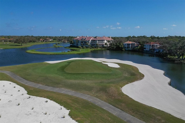 view of home's community featuring a water view and view of golf course