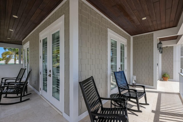 view of patio / terrace featuring covered porch and french doors