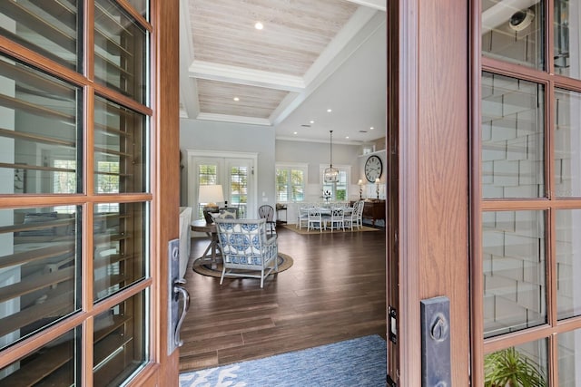 foyer entrance with ornamental molding, dark wood-style flooring, beamed ceiling, french doors, and recessed lighting